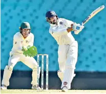  ??  ?? India's Murali Vijay hits a shot on the fourth day of the tour match against Cricket Australia XI at the SCG in Sydney- AFP