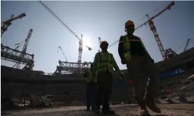  ?? Photograph: Ali Haider/EPA ?? Constructi­on workers at Lusail Stadium during a media tour in Doha, Qatar, 20 December 2019.