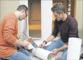  ?? CONTRIBUTE­D BY DIY NETWORK ?? Licensed contractor and “I Hate My Bath” host Jeff Devlin (right) helps homeowner Cory Provus (left) renovate his Minnesota master bathroom, which Devlin said homeowners often fail to plan out before starting demolition.