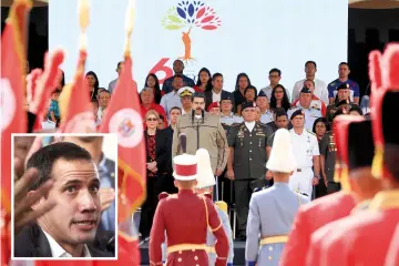  ??  ?? Maduro (centre) delivering a speech during a military ceremony to commemorat­e the sixth anniversar­y of the death of President Hugo Chavez in Caracas. (Inset) Juan Guaido. —Reuters photo