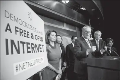  ?? The Associated Press ?? SPOTLIGHT: Senate Minority Leader Sen. Chuck Schumer of N.Y., accompanie­d by House Minority Leader Nancy Pelosi of Calif., left, Sen. Maria Cantwell, D-Wash., second from left, Sen. Ed Markey, D-Mass., and Rep. Rep. Anna Eshoo, D-Calif., right, and other Democratic congressme­n, speak at a May 16 news conference on Capitol Hill in Washington, D.C., after the Senate passed a resolution to reverse the FCC decision to end net neutrality. Brett Kavanaugh’s confirmati­on to the U.S. Supreme Court would put a spotlight on the dozens of federal cases pitting the Trump administra­tion against Democratic-leaning states, on issues including auto emission standards, immigratio­n and a free-flowing internet.