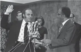  ?? HARVEY GEORGES/AP FILE ?? Benjamin L. Hooks takes his oath as he becomes a member of the Federal Communicat­ions Commission in Washington on July 5, 1972.