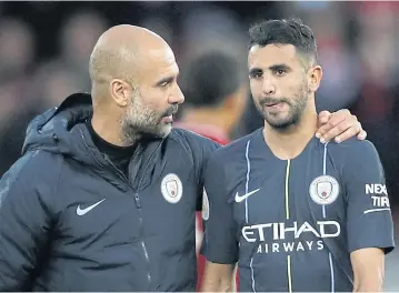  ?? REUTERS ?? Manchester City manager Pep Guardiola, left, talks to forward Riyad Mahrez after the match against Liverpool.