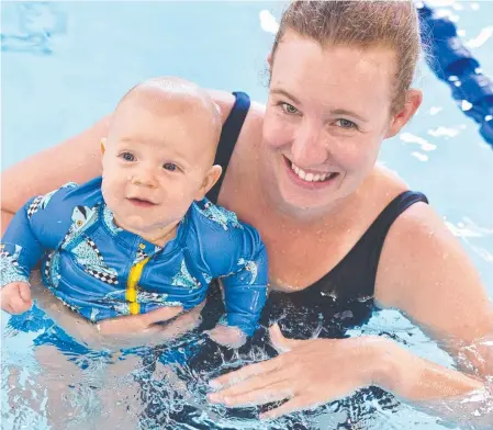  ?? Picture: Kevin Farmer ?? SWIMMING LESSONS: Jess Breeze with baby Noah in a class during the opening of The Glennie School program pool.