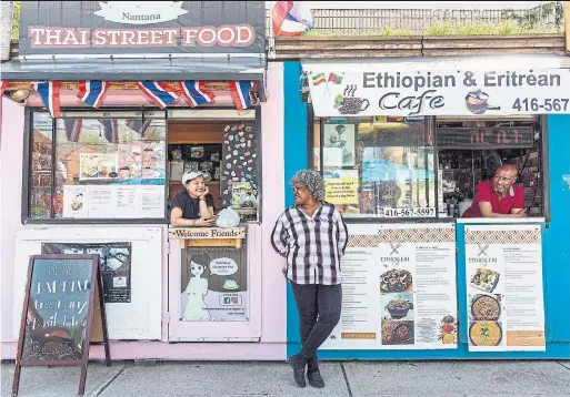  ?? NICK KOZAK PHOTOS FOR THE TORONTO STAR ?? Nantana Salanont, left, Etse Hiwot and Kebede Batt in front of Nantana Thai Food & Desserts and Ethiopian and Eritrean Café at Market 707.