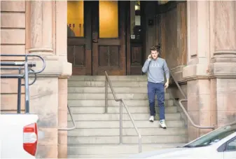  ?? Amy Osborne / Special to The Chronicle ?? A man wearing a Juul shirt leaves the e-cigarette firm’s headquarte­rs at San Francisco’s Pier 70.