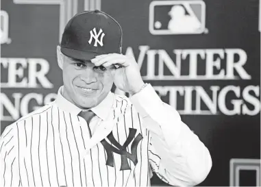  ??  ?? Giancarlo Stanton, during his introducto­ry news conference Monday after being traded to the Yankees, strongly disagreed with Derek Jeter and the Marlins’ plans to rebuild. KIM KLEMENT/USA TODAY SPORTS