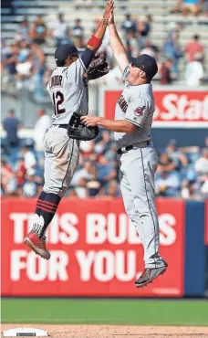  ?? NOAH K. MURRAY, USA TODAY SPORTS ?? Francisco Lindor, left, and Jay Bruce enjoy the Indians’ victory Wednesday vs. the Yankees in the opener of a doublehead­er.