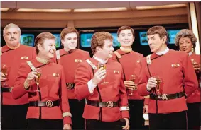  ?? BOB GALBRAITH/AP PHOTO ?? Members of the “Star Trek” crew, from left, James Doohan, DeForest Kelley, Walter Koenig, William Shatner, George Takei, Leonard Nimoy and Nichelle Nichols, toast the newest “Star Trek” film during a 1988 news conference at Paramount Studios in Los Angeles.