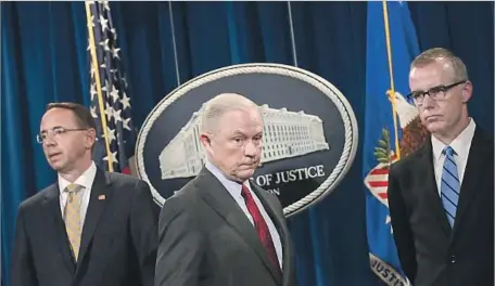  ?? Chip Somodevill­a Getty Images ?? BECAUSE Atty. Gen. Jeff Sessions, center, recused himself, only his deputy, Rod Rosenstein, left, can fire the special counsel, not pictured.