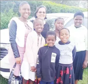  ?? ?? Dr Elizabeth Hynd, committee member of Somhlolo with kids at the festival.