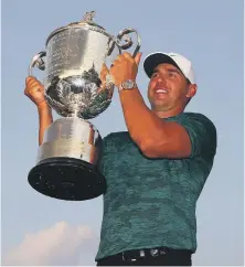  ?? Getty ?? Brooks Koepka celebrates after winning the PGA Championsh­ip at the Bellerive Golf Course in Missouri on Sunday night
