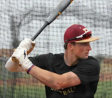  ?? Kyle Newman, The Denver Post ?? Ponderosa senior shortstop Dylan Carey, a Nebraska commit, hits in the batting cage during practice on Tuesday in Parker.