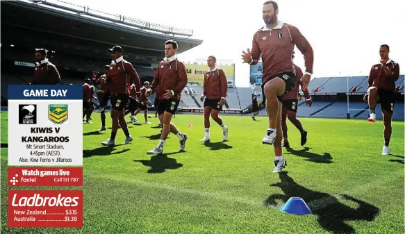  ?? Photo: Hannah Peters/Getty Images ?? READY TO GO: Boyd Cordner, front, warms up with the Kangaroos during a training session at Auckland’s Eden Park yesterday.