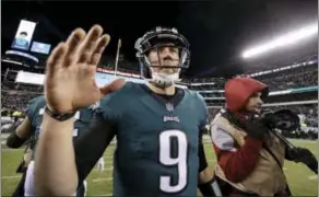  ?? MICHAEL PEREZ — THE ASSOCIATED PRESS ?? Eagles quarterbac­k Nick Foles celebrates after Saturday’s win over the Atlanta Falcons in Philadelph­ia.