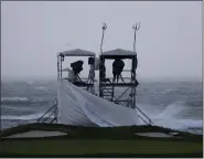  ?? RYAN SUN — THE ASSOCIATED PRESS ?? Fallen tarps are shown on a video camera platform at Pebble Beach Golf Links before the scheduled final round of the AT&T Pebble Beach National Pro-am in Pebble Beach, Calif. on Sunday.