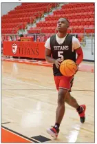  ??  ?? Senior Braxton Brown eyes the basket as he moves inside the paint. Head coach Victor Joyner said Brown is one of the most athletic kids on the team.