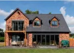  ??  ?? Above left: A timber frame structure in place ready for the next stages. Top: This striking timber home by Frame Technologi­es boasts heaps of wow factor. Above: A timber frame home can be finished in a wide variety of materials