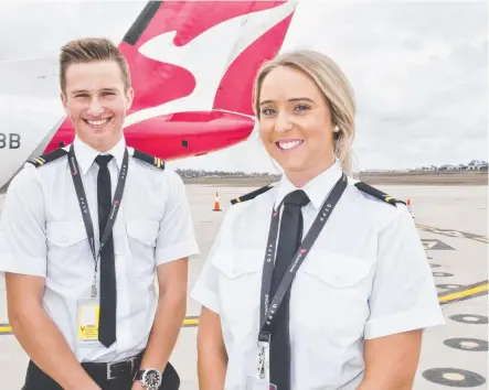  ?? SOARING GOALS: University of Southern Queensland students Tom Fanshawe and Kimberley Pike at yesterday’s Qantas pilot training academy announceme­nt at Wellcamp Airport in Toowoomba. ??