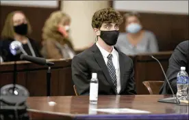  ?? TAMPA BAY TIMES ?? Cameron Herrin reacts as he hears his sentence Thursday at the Hillsborou­gh County Edgecomb Courthouse in Tampa, Florida. Herrin received 24 years in prison for killing an Ohio mother and her young daughter in a 2018 traffic crash.