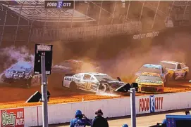  ?? WADE PAYNE/ASSOCIATED PRESS ?? Driver Aric Almirola (10) collides with Anthony Alfredo (38) during a NASCAR Cup Series auto race on Monday in Bristol, Tenn.