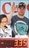  ?? CLIFFORD SKARSTEDT Examiner ?? Bryan Bickell, a Stanley Cup winner this year with the Chicago Blackhawks, waves to the crowd during the Fishing For The Cure charity fishing tournament on Thursday at Del Crary Park.