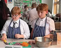  ?? ?? Children from Merchants’ Academy in Withywood attending cookery classes with food writer Kate Percy