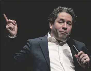  ?? AP PHOTO/JOHN MINCHILLO ?? Gustavo Dudamel is introduced as the New York Philharmon­ic’s 27th music and artistic director, on Monday in the newly renovated David Geffen Hall at Lincoln Center for the Performing Arts in New York.