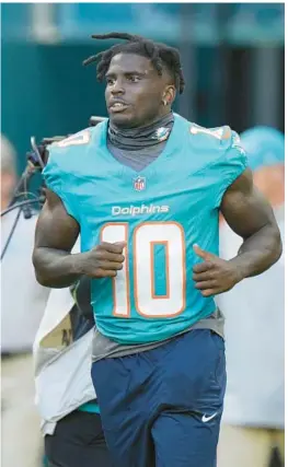  ?? WILFREDO LEE/AP ?? Miami Dolphins wide receiver Tyreek Hill heads onto the field before a preseason game against the Falcons Aug. 11, 2023, in Miami Gardens.