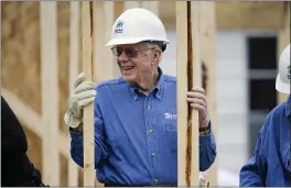  ?? MARK HUMPHREY — THE ASSOCIATED PRESS FILE ?? In this file photo, former President Jimmy Carter works at a Habitat for Humanity building site in Memphis, Tenn., on Nov. 7, 2015.