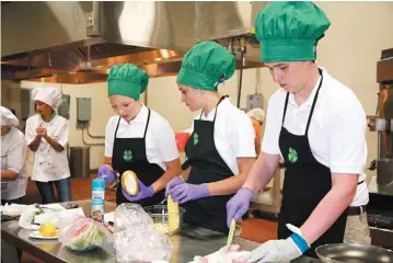  ?? PHOTO PROVIDED ?? 4-H members compete in the Food Showdown contest at the 4-H roundup this year in Stillwater.