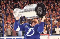  ?? Bruce Bennett / Getty Images ?? Lightning captain Steven Stamkos hoists the Stanley Cup after a 1-0 victory against the Montreal Canadiens in Game 5 of the Stanley Cup Final at Amalie Arena on July 7 in Tampa, Fla.