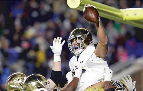  ?? ASSOCIATED PRESS FILE PHOTO ?? Notre Dame wide receiver Chase Claypool celebrates a touchdown against Duke during a Nov. 9 game in Durham, N.C. Colleges like Notre Dame are still trying to decide whether it’s worth the risk of playing during the pandemic or losingout on potentiall­y huge amounts of revenue.