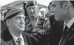  ?? REUTERS ?? French President Emmanuel Macron listens to French war veteran Leon Gautier, a member of the Kieffer commando, during a D-day commemorat­ion ceremony in memory of marines and the famed Kieffer commandos who took part in D-day landings, in Colleville-montgomery, France.