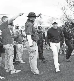  ?? ?? Rory McIlroy walks to the fairway on the 11th hole during the third round at TPC Scottsdale on Saturday.