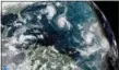  ?? NOAA VIA AP ?? This enhanced satellite image made available by NOAA shows Tropical Storm Florence, center, in the Atlantic Ocean on Saturday at 2:45 p.m. EDT.