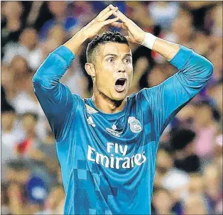  ?? AP PHOTO ?? In this photo taken on Sunday, Real Madrid’s Cristiano Ronaldo reacts after being shown a second yellow card by referee Ricardo de Burgos during the Spanish Supercup, first leg, soccer match between FC Barcelona and Real Madrid at the Camp Nou stadium...