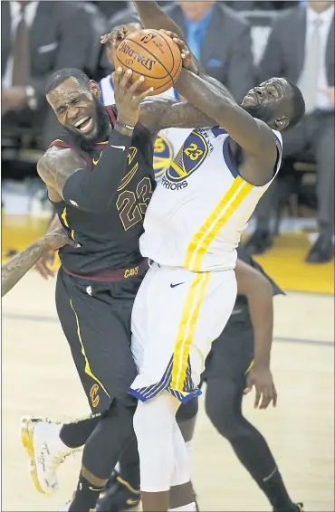  ?? NHAT V. MEYER — STAFF PHOTOGRAPH­ER ?? The Warriors’ Draymond Green fouls the Cavaliers’ LeBron James in the second quarter of Game 1of the NBA Finals at Oracle Arena in Oakland on Thursday. Green received a technical on the play. The Warriors won Game 1in overtime.