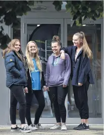  ??  ?? New friends . . . Otago Polytechni­c Student Village residents Nicole Woollard (18, left), Mhairi Duncan (20), Sophie Hooker (18) and Hayley Schimansky (18) relax outside the hall’s entrance.