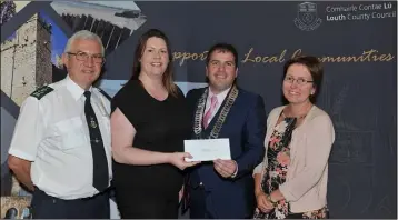  ??  ?? Teacher Edel Ní Ghealbhain, Gaelscoil Dhún Dealgan receives the Teacher of the Year award 9Dundalk Municipal District) from Cllr. Liam Reilly, Chairman of LCC watched by Cllr. Maeve Yore and Litter warden, Eugene Birch at the Louth Local Authoritie­s...