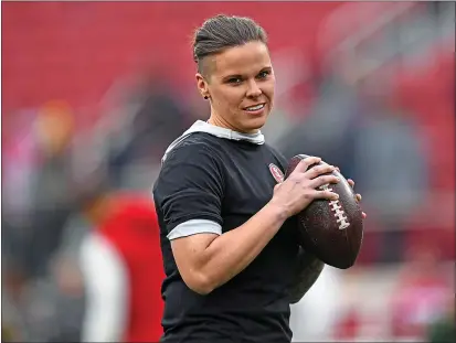  ?? JOSE CARLOS FAJARDO — BAY AREA NEWS GROUP ?? San Francisco 49ers offensive assistant Katie Sowers throws passes on the field before their NFC Championsh­ip game against the Green Bay Packers at Levi’s Stadium in Santa Clara on Sunday.