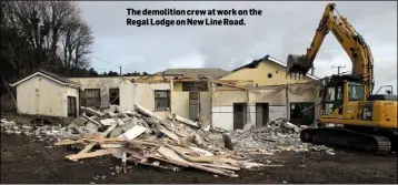  ??  ?? The demolition crew at work on the Regal Lodge on New Line Road.