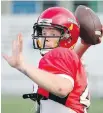  ??  ?? Quarterbac­k Ashton Mackinnon leads the Rebels into Langley this afternoon.