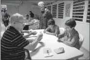  ?? AP/MATHURIN DEREL ?? Polling station officials count the votes Sunday as part of the independen­ce referendum in Noumea, New Caledonia’s capital.