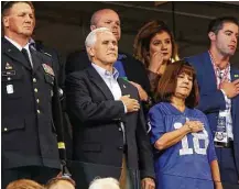  ?? Michael Conroy / Associated Press ?? Vice President Mike Pence stands during the national anthem Sunday at an NFL game in Indianapol­is. Afterward, he made an early exit in protest of 49ers players kneeling.