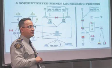  ?? CP PHOTO ?? RCMP Sgt. Francois-Olivier Myette explains the dismantlin­g of an internatio­nal money laundering network during a news conference on Tuesday in Montreal.