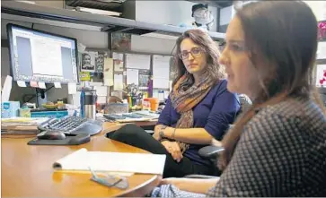  ?? Francine Orr Los Angeles Times ?? RACHEL RAY, left, an attorney at the UC Immigrant Legal Services Center, listens to Desi Fairly, an attorney fellow, during a meeting at the UC Davis center, which assists students at every UC campus but Berkeley.