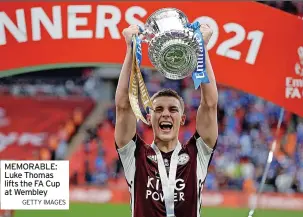  ?? GETTY IMAGES ?? MEMORABLE: Luke Thomas lifts the FA Cup at Wembley