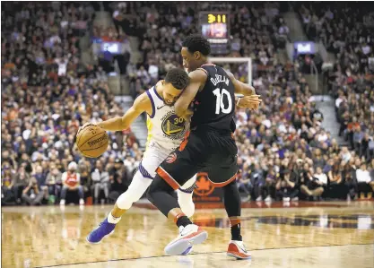  ?? PHOTOS BY COLE BURSTON — THE CANADIAN PRESS VIA AP ?? Stephen Curry, back in action after missing two games with a sore right ankle, drives to the hoop during the Warriors’ 127-125 win in Toronto.