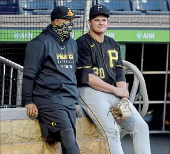  ?? Matt Freed/Post-Gazette ?? PRIME SEATING Pirates pitching coach Oscar Marin, left, talks with pitcher Kyle Crick Wednesday during an intrasquad game at PNC Park.